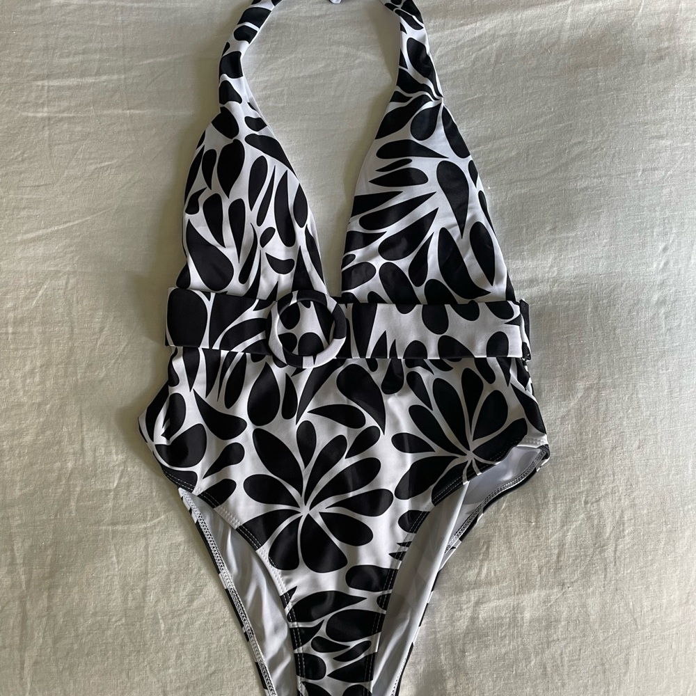 New one piece bathing suit w belt.